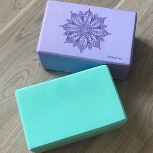 Purple and Green Yoga Blocks